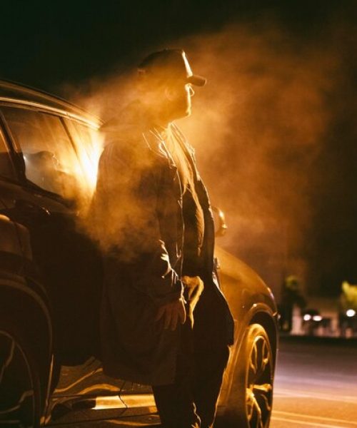 man-sitting-car-night_23-2149001285